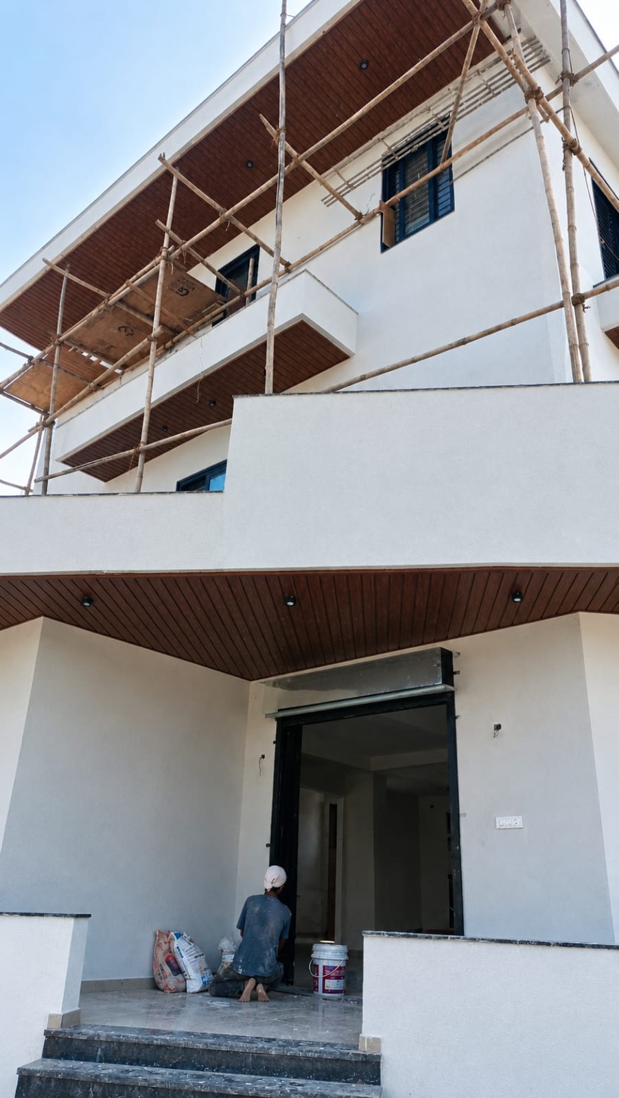 Exterior site photo, wood-finish soffit aur scaffolding